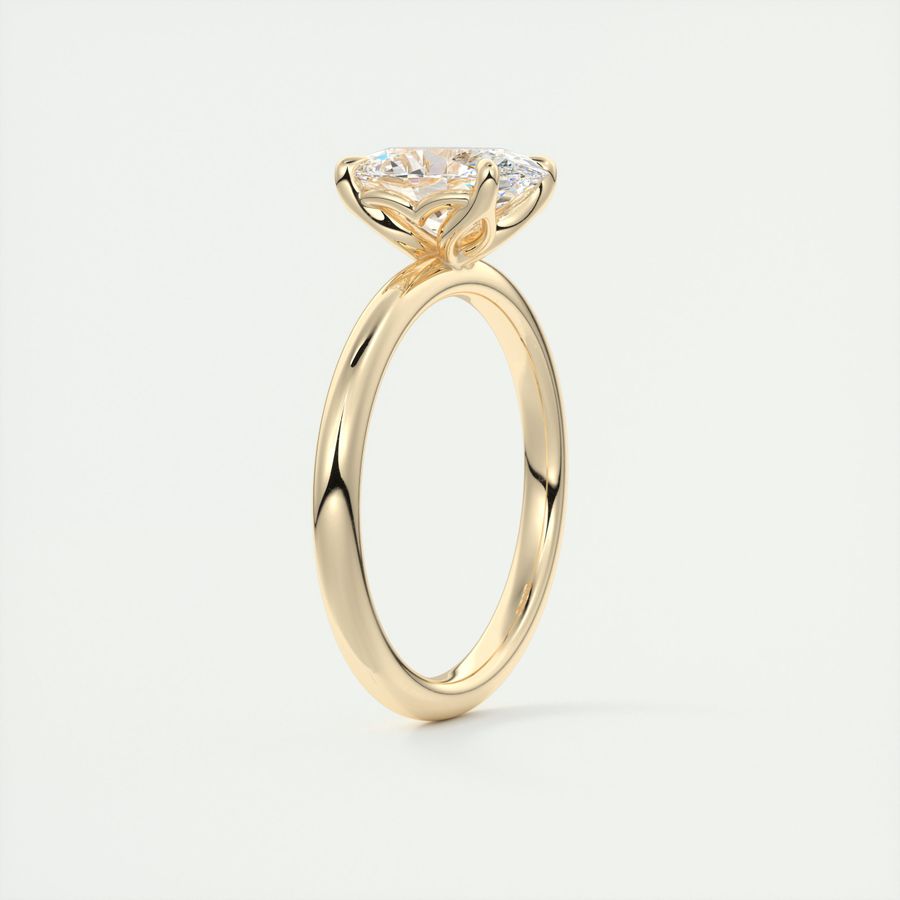 Oval cut solitaire Frank Darling lab grown diamond engagement ring with floral prongs, low profile basket and 1.8mm band in yellow gold